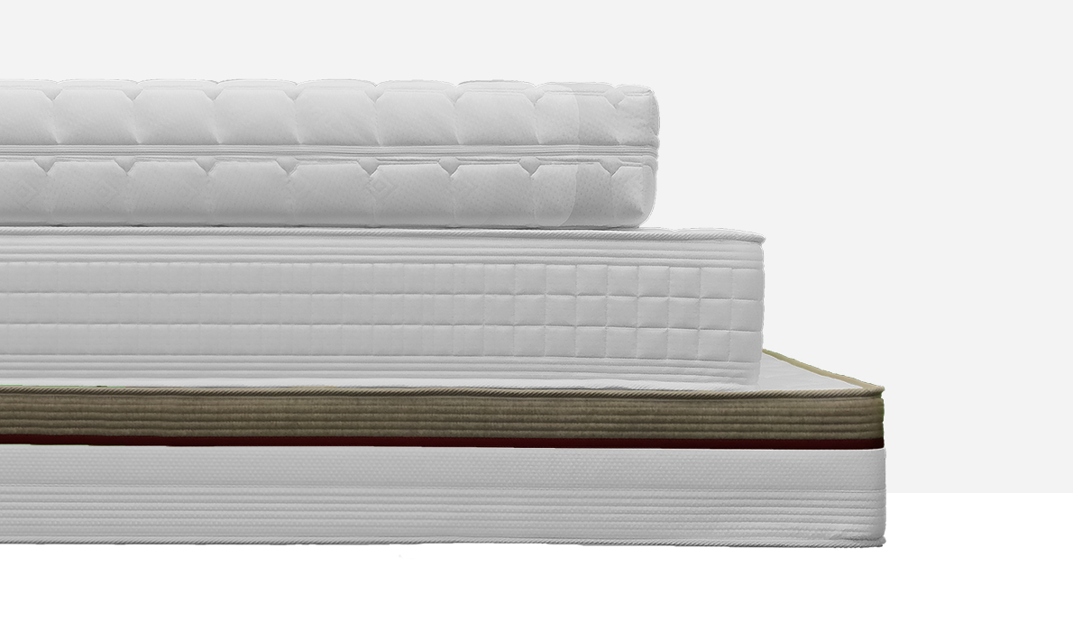 Three luxurious caravan mattresses elegantly stacked on top of one another, creating an eye-catching hero image showcasing comfort and quality