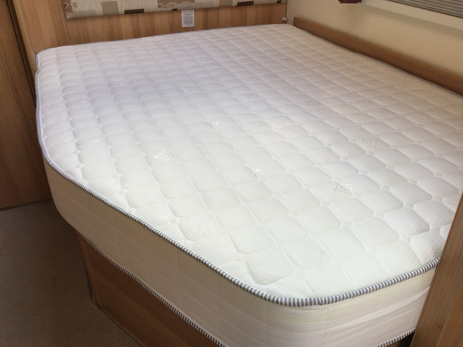 Nearside Angled Cut Mattress Inside a Caravan AKA Made-to-Measure Mattress