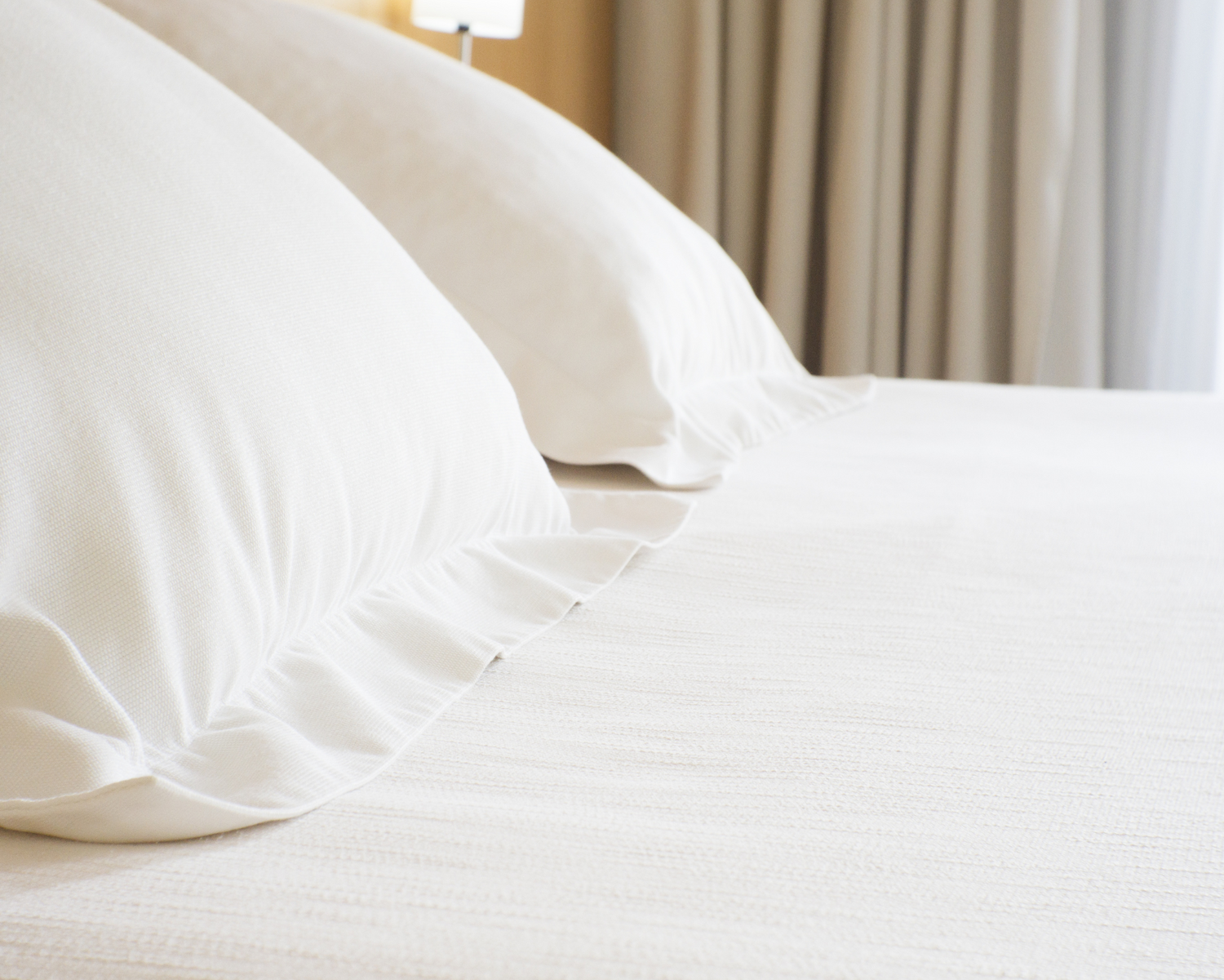 Sparkly clean washed and ironed bed sheets and pillow covers.