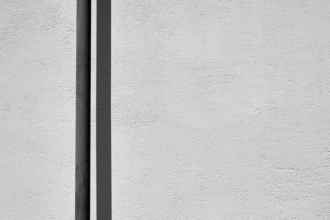 a black and white photo of a street sign