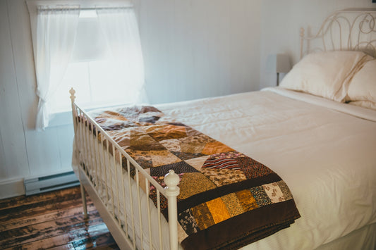 white and brown bed linen
