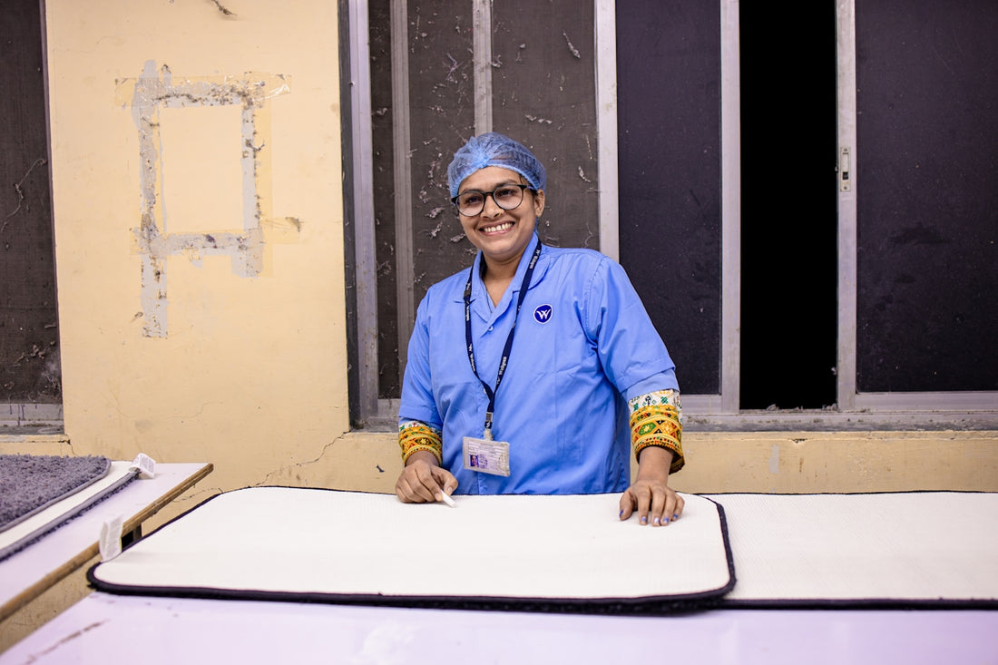 A medical worker smiles at the camera.