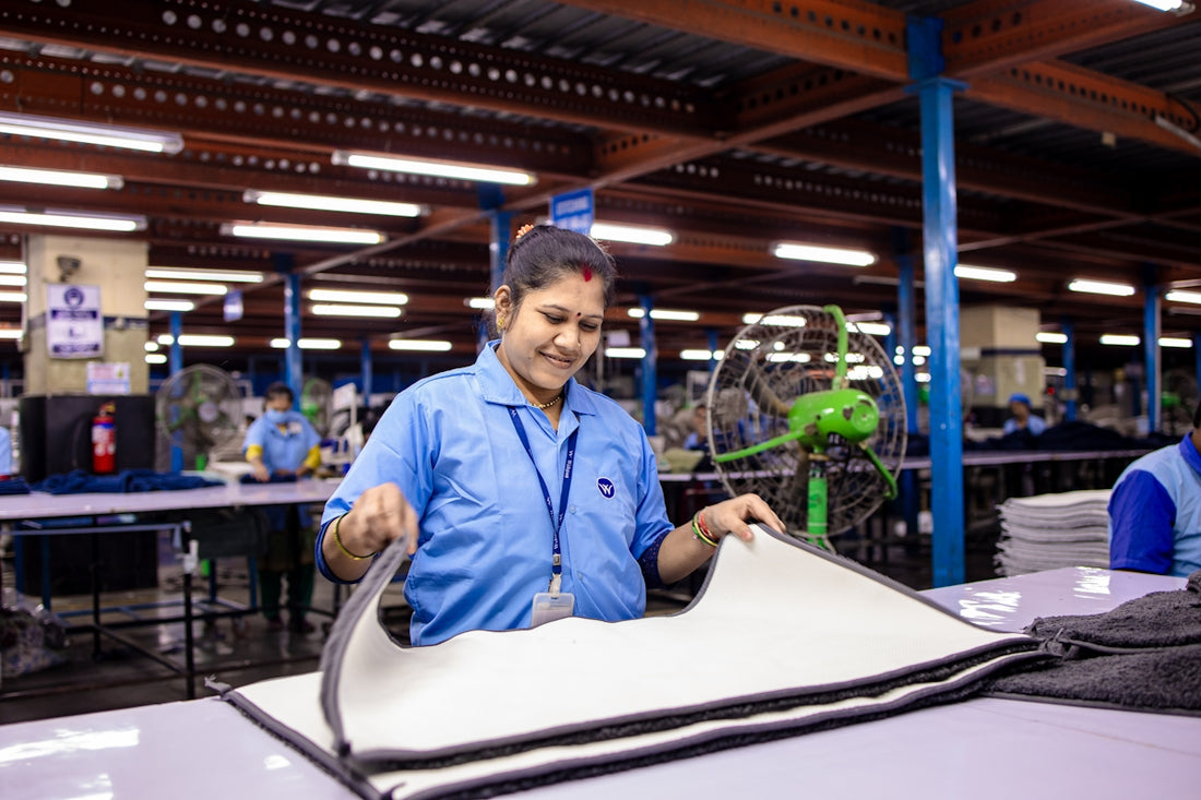 Woman working in a clothing manufacturing factory.