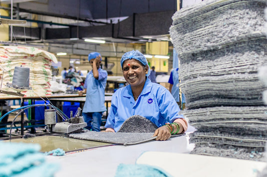 Woman works in a textile factory.