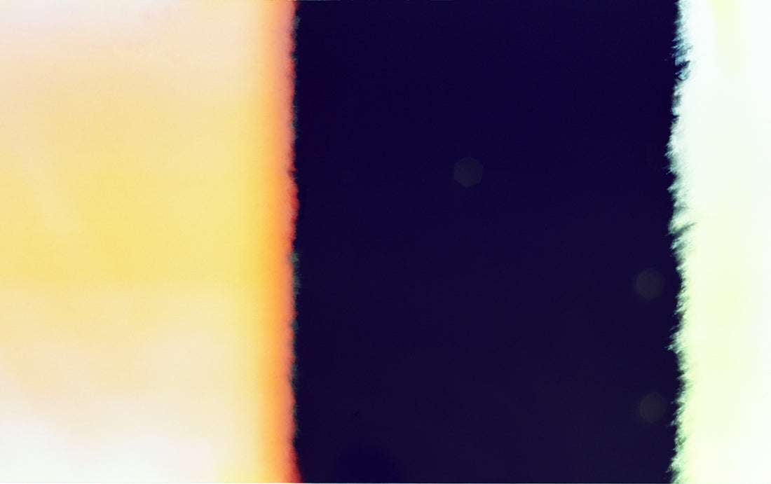 Abstract colorful light leak effect on dark background