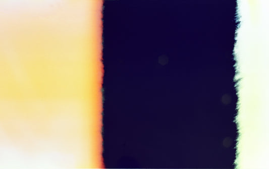 Abstract colorful light leak effect on dark background