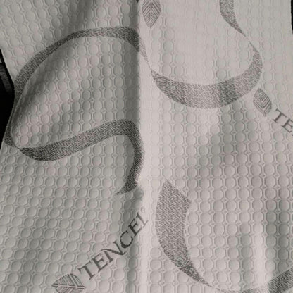 Close-up of the soft, breathable Tencel fabric used on a caravan mattress.