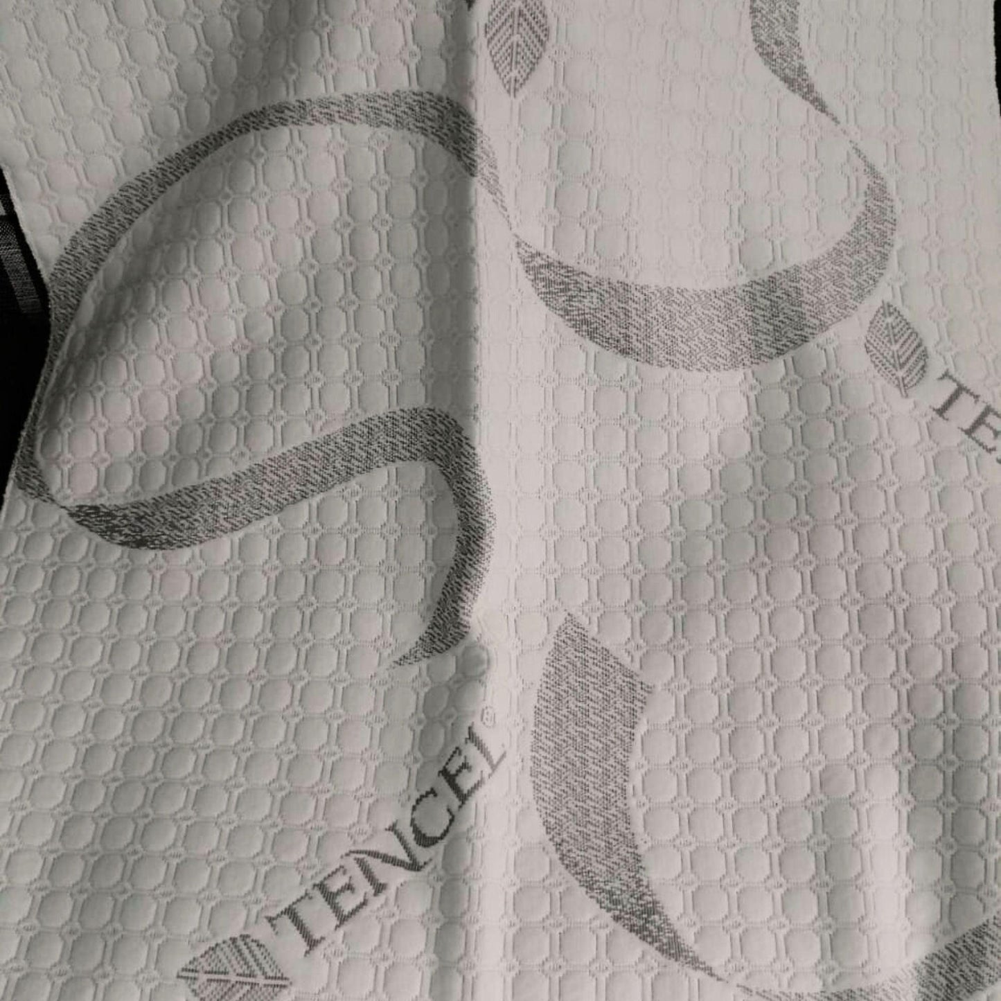 Close-up of soft, breathable Tencel fabric used on a caravan mattress.