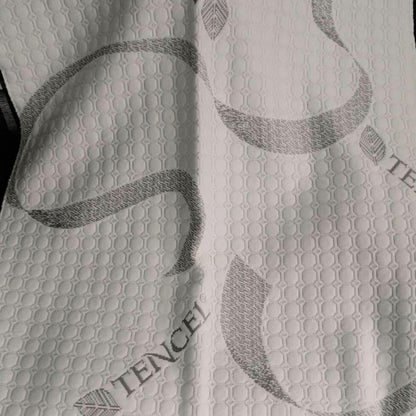 Close-up of soft, breathable Tencel fabric used on a caravan mattress.