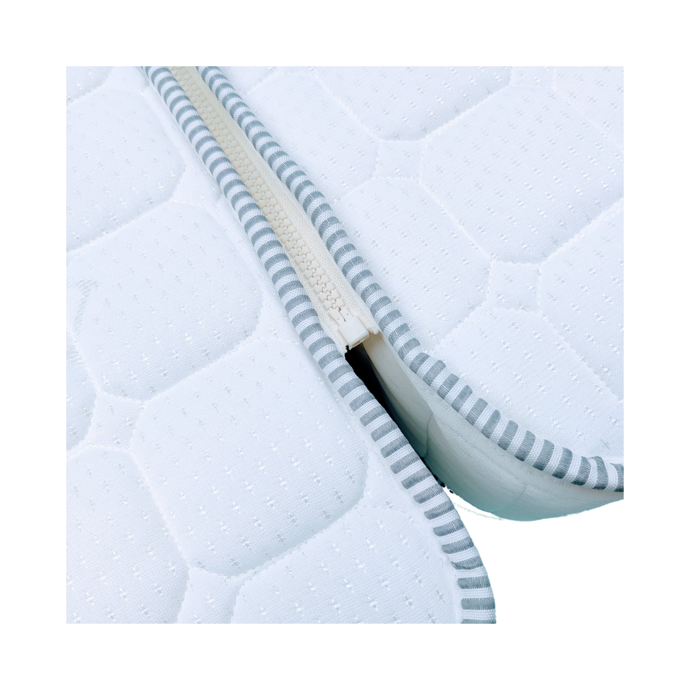 Close-up image of a bespoke zip-and-link mattress, showing the detailed zip attachment connecting the mattress to the zip-attached bolster.